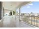 Covered porch with white columns overlooking the neighborhood at 5220 Mount Pleasant Dr., Myrtle Beach, SC 29579