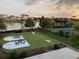 Outdoor recreational area featuring tennis court and cornhole, near a lake at 5220 Mount Pleasant Dr., Myrtle Beach, SC 29579