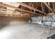 Large unfinished room shows exposed beams and insulated walls, offering potential for customization at 5220 Mount Pleasant Dr., Myrtle Beach, SC 29579