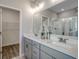 Stylish bathroom with a dual-sink vanity, quartz countertops, and a glass-enclosed shower at 5419 Shelly Lynn Dr., Myrtle Beach, SC 29579