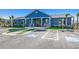 Community clubhouse featuring blue siding, rocking chairs, and handicapped parking spaces for accessibility at 5419 Shelly Lynn Dr., Myrtle Beach, SC 29579