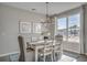 Bright dining room with a modern chandelier and a large window at 5419 Shelly Lynn Dr., Myrtle Beach, SC 29579