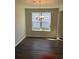 Cozy dining room featuring wood floors, a chandelier, and natural light from the window at 5419 Shelly Lynn Dr., Myrtle Beach, SC 29579