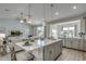 Open concept kitchen with a large island, stainless appliances, and views of the living area at 5419 Shelly Lynn Dr., Myrtle Beach, SC 29579