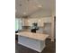 Stylish kitchen with white cabinets, island, stainless appliances, and modern pendant lighting at 5419 Shelly Lynn Dr., Myrtle Beach, SC 29579