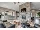 Open-concept living room with stone fireplace and kitchen view, perfect for entertaining and socializing at 5419 Shelly Lynn Dr., Myrtle Beach, SC 29579