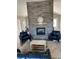 Inviting living room featuring a stone fireplace, comfortable seating, and rustic decor for a cozy ambiance at 5419 Shelly Lynn Dr., Myrtle Beach, SC 29579