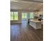 Open-concept living space with modern kitchen and large windows, perfect for entertaining at 5419 Shelly Lynn Dr., Myrtle Beach, SC 29579