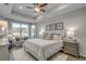 Inviting bedroom featuring a tray ceiling, large window, and views of the water at 5419 Shelly Lynn Dr., Myrtle Beach, SC 29579