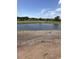 Scenic pond view under a blue sky, enhancing the natural beauty of the property's surroundings at 5419 Shelly Lynn Dr., Myrtle Beach, SC 29579
