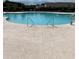 An inviting swimming pool features convenient access steps, perfect for enjoying a leisurely swim at 5419 Shelly Lynn Dr., Myrtle Beach, SC 29579