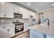 Well-equipped kitchen with stainless steel appliances, granite countertops and white cabinetry at 5430 Shelly Lynn Dr., Myrtle Beach, SC 29579
