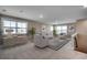 Cozy living area with lots of natural light and neutral colored walls and carpet at 5430 Shelly Lynn Dr., Myrtle Beach, SC 29579