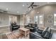 Inviting living room with stylish seating, a ceiling fan, and a view to the outside through glass doors at 5430 Shelly Lynn Dr., Myrtle Beach, SC 29579