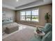 Relaxing main bedroom with tray ceiling, large windows with pleasant outside views, and sitting area at 5430 Shelly Lynn Dr., Myrtle Beach, SC 29579