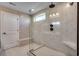 Modern tiled shower with glass enclosure, seating, a shower-head, and neutral color scheme at 5430 Shelly Lynn Dr., Myrtle Beach, SC 29579