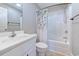 Well-lit bathroom featuring white fixtures, a tub-shower combo, and a large mirror at 544 Fox Chase Dr., Conway, SC 29527