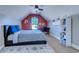 Cozy bedroom featuring a window, a sloped ceiling, a red accent wall, and wood-look flooring at 544 Fox Chase Dr., Conway, SC 29527