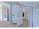 Hallway leading to bedroom and bathroom, also showing the closet and wood-look flooring at 544 Fox Chase Dr., Conway, SC 29527