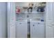 Convenient laundry room with washer, dryer, and shelving offers functional space for chores at 544 Fox Chase Dr., Conway, SC 29527