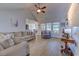 Cozy living room showcasing vaulted ceilings, wood flooring, and lots of bright natural light at 544 Fox Chase Dr., Conway, SC 29527
