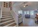 Open-concept living room with wood floors, a vaulted ceiling, and large windows for natural light at 544 Fox Chase Dr., Conway, SC 29527