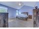 This comfortable main bedroom boasts rustic wood furniture and lots of natural light at 544 Fox Chase Dr., Conway, SC 29527