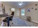 Home office featuring a beachy wall-mounted television, wooden floors, and a light-colored accent wall at 544 Fox Chase Dr., Conway, SC 29527