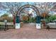 Scenic park entrance with a brick path and archway, surrounded by beautiful trees and landscaping at 544 Fox Chase Dr., Conway, SC 29527