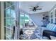 Covered patio provides a relaxing outdoor living space with comfortable seating and ceiling fan at 544 Fox Chase Dr., Conway, SC 29527