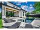 Beautiful backyard with a pool, patio, lounge chairs, and a covered patio area at 5515 Porcher Ave., Myrtle Beach, SC 29577