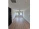 Bright, airy bedroom with hardwood floors, modern lighting, and large windows at 5515 Porcher Ave., Myrtle Beach, SC 29577