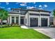 Modern two-story home with a manicured lawn, dark framed windows and two-car garage at 5515 Porcher Ave., Myrtle Beach, SC 29577