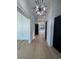 Hallway featuring modern lighting, doors, and light hardwood floors at 5515 Porcher Ave., Myrtle Beach, SC 29577