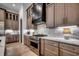 Gourmet kitchen with custom cabinets, stainless steel appliances, and marble backsplash at 5515 Porcher Ave., Myrtle Beach, SC 29577