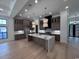 A large kitchen with an island, ample counter space, and contemporary lighting at 5515 Porcher Ave., Myrtle Beach, SC 29577