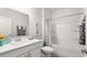 Well-lit bathroom featuring a single sink vanity and tub/shower combo at 585 Haven View Way, Murrells Inlet, SC 29576