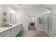 Bright bathroom with double vanity, framed mirrors, and glass shower doors at 585 Haven View Way, Murrells Inlet, SC 29576