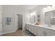Bright bathroom with double vanity, framed mirrors, and modern fixtures at 585 Haven View Way, Murrells Inlet, SC 29576