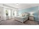 Serene bedroom with natural light, a cozy bed, and relaxing decor at 585 Haven View Way, Murrells Inlet, SC 29576