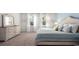 Bright bedroom with soft lighting, neutral tones, and a dresser at 585 Haven View Way, Murrells Inlet, SC 29576