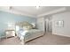 Spacious bedroom with soft carpet, cozy bed, and neutral decor at 585 Haven View Way, Murrells Inlet, SC 29576