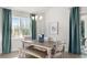 Dining room with natural light, and wooden table with seating for six at 585 Haven View Way, Murrells Inlet, SC 29576