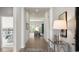 Hallway showcasing the home's decor and leading to living area and bedroom at 585 Haven View Way, Murrells Inlet, SC 29576