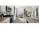 Modern kitchen showcasing granite countertops, stainless steel appliances, and a breakfast bar at 585 Haven View Way, Murrells Inlet, SC 29576