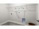 Bright laundry room with grey flooring, white walls, storage shelf, and appliances hookups at 585 Haven View Way, Murrells Inlet, SC 29576