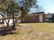A well-maintained backyard featuring a brick house with a private entrance and green space at 633 Redwood Ave. # 1, Myrtle Beach, SC 29577