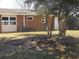 A well-maintained backyard featuring a brick house with a private entrance and green space at 633 Redwood Ave. # 1, Myrtle Beach, SC 29577