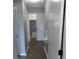Hallway featuring hardwood floors and easy access to bedroom closets at 633 Redwood Ave. # 1, Myrtle Beach, SC 29577