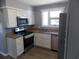 Modern kitchen with stainless steel appliances and ample cabinet space at 633 Redwood Ave. # 1, Myrtle Beach, SC 29577